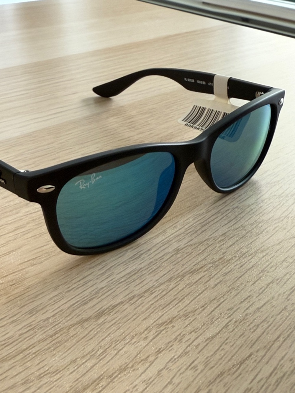 Ray-Ban Jr Black Frame Sunglasses with Blue Mirrored Lenses